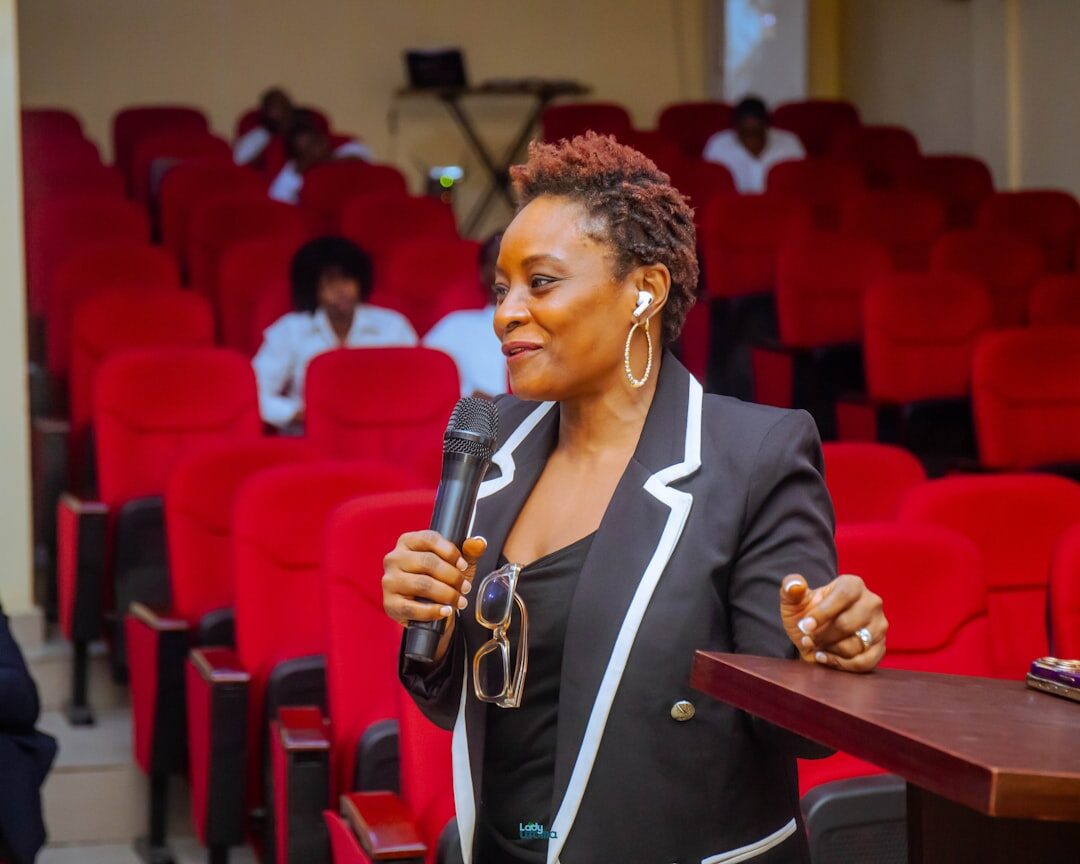 Confident speaker engaging with an audience at a conference 