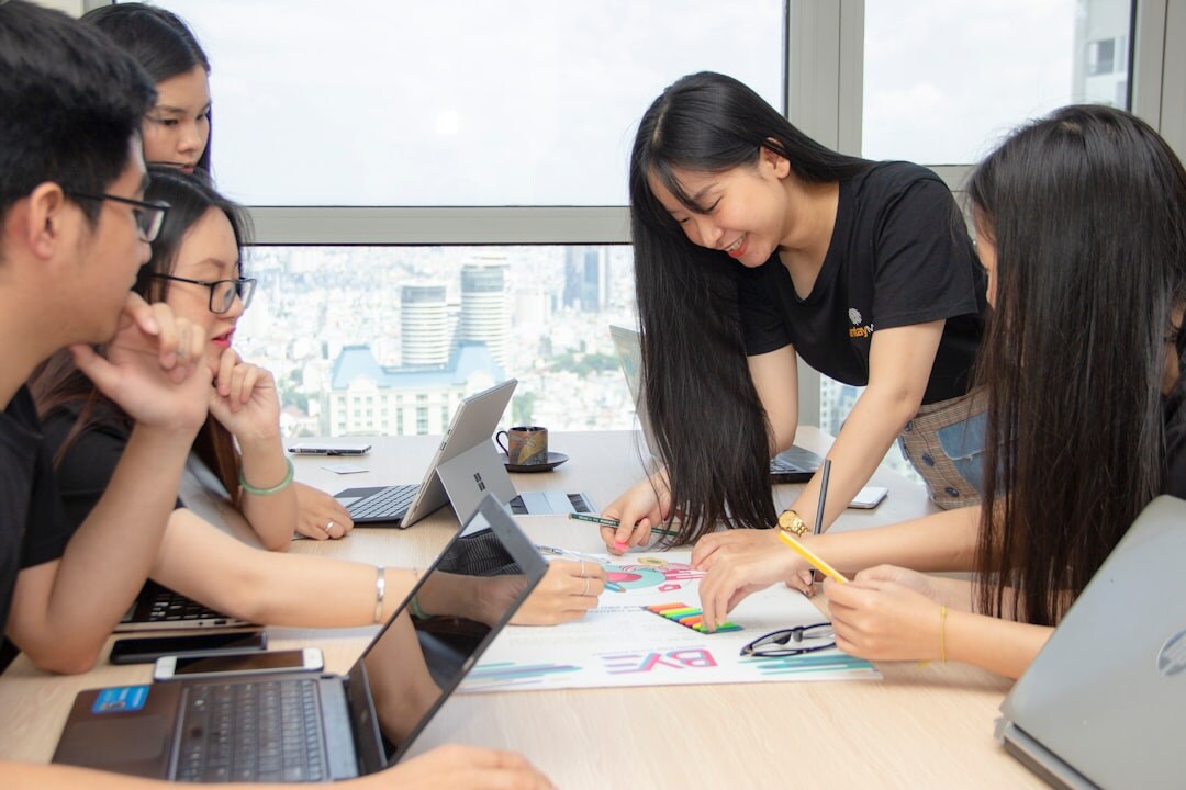 Professionals collaborating in a modern communication workshop 