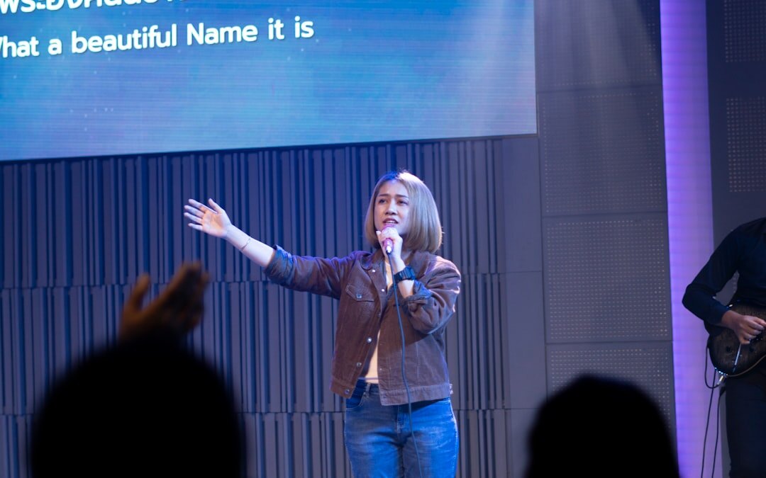 Professional female moderator presenting at a business conference 